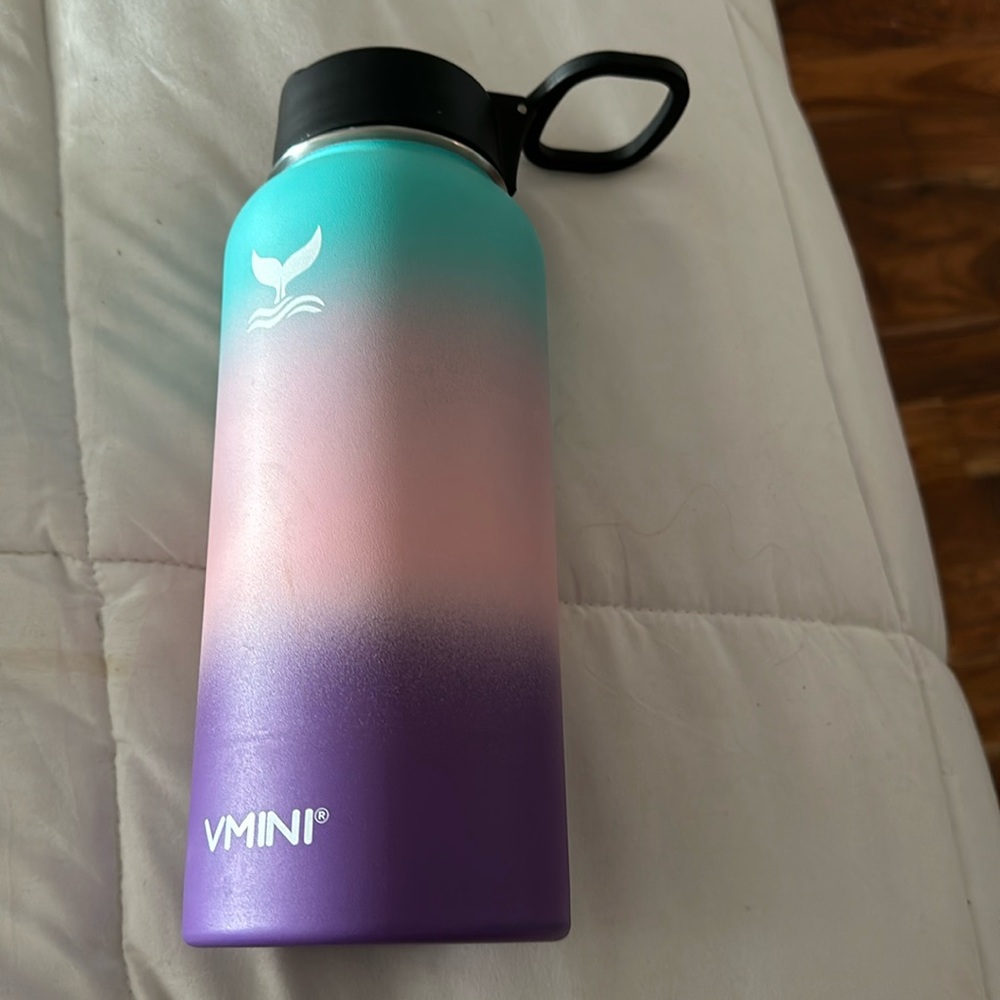 Multi colored vmini water bottle with matching boot.